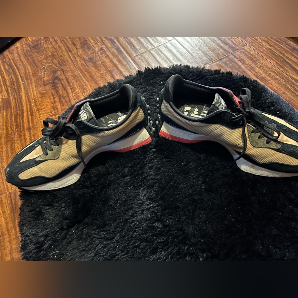 New balance.. very nice shoe .7.5 in men 9 in women’s.